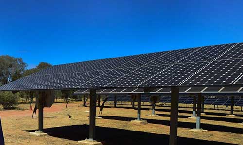 Bank of solar panels in paddock