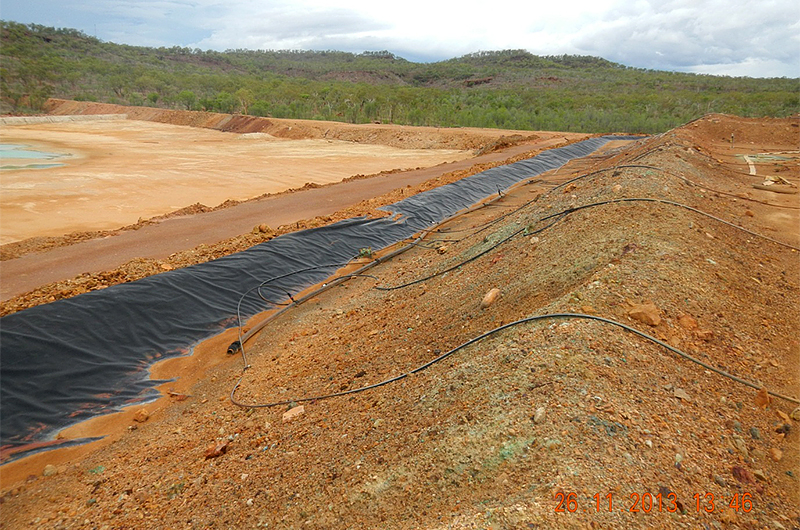 View of the heap leach pad and associated irrigation system on the right and part of the tailings dam to the left (2013)