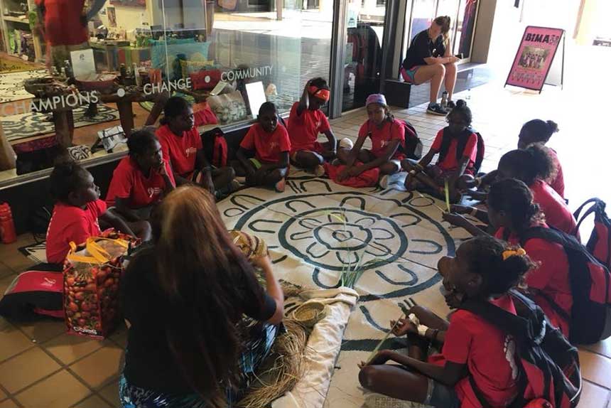 Tiwi students sitting in a circle at the Starwin stored in Darwin