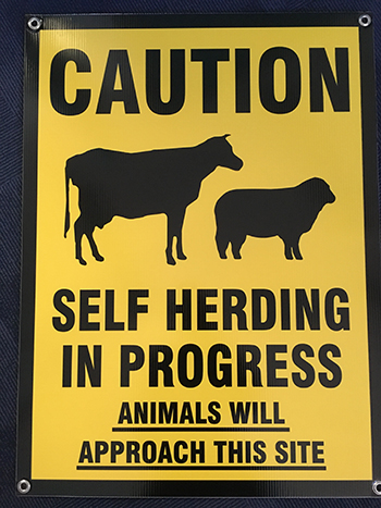 Caption: Self Herding Sign that has been created by Bruce Maynard to visually attract cattle to an attractant station. Attractant stations can be used to encourage stock to spend time grazing particular areas and as a tool for reducing stress in unfamiliar situations. They typically include tasty feed supplements as well as visual and sound cues.