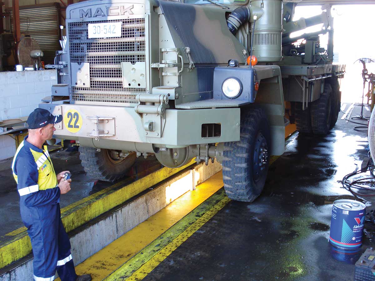 Workman working on a defence truck