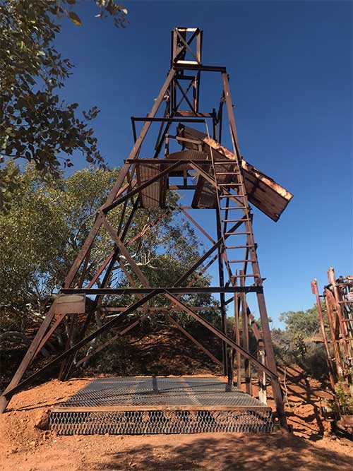 A historical headframe showing a cover installed over an open shaft in the vicinity of Tennant Creek.
